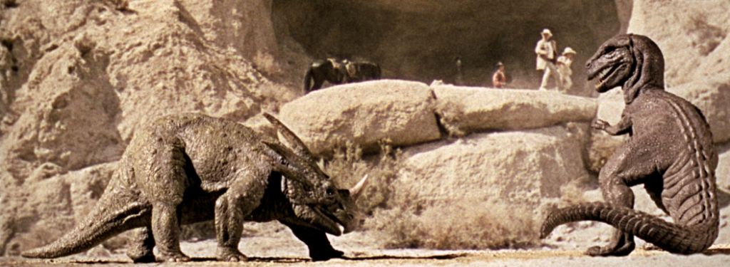 Two old dinosaurs square off and prepare to do battle. The scene is a stop motion shot from a film called the Valley of Gwangi. 